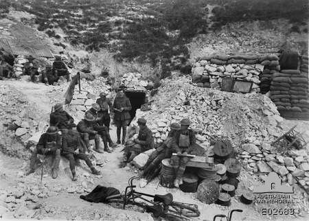Intelligence officers from 4th Brigade AIF synchronising watches near Hamelet, 3 July 1918 (Australian War Memorial)